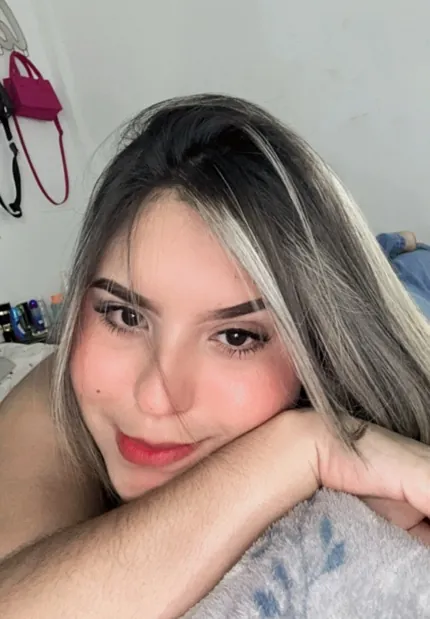 Adult woman resting her chin on her hands, camera portrait